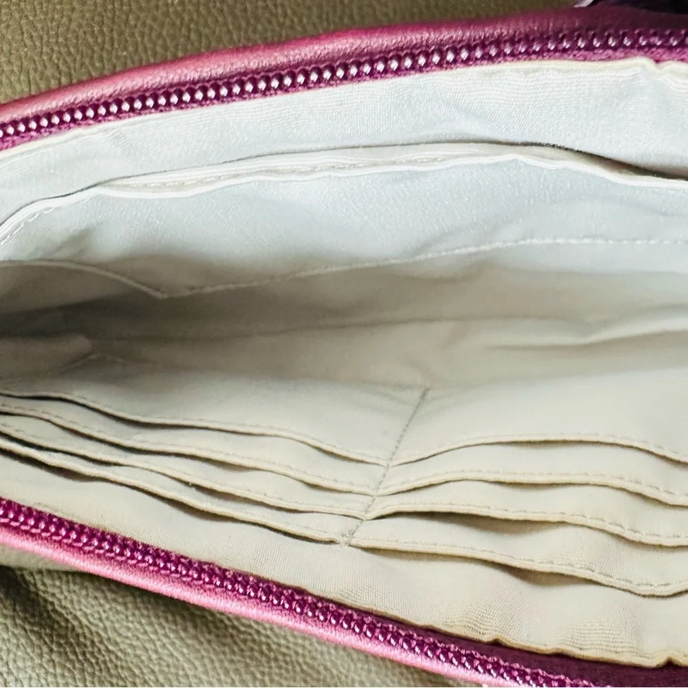 Coach Wristlet with suede flowers. Upstyled for a fresh new look. 9.25x5.5 x1”